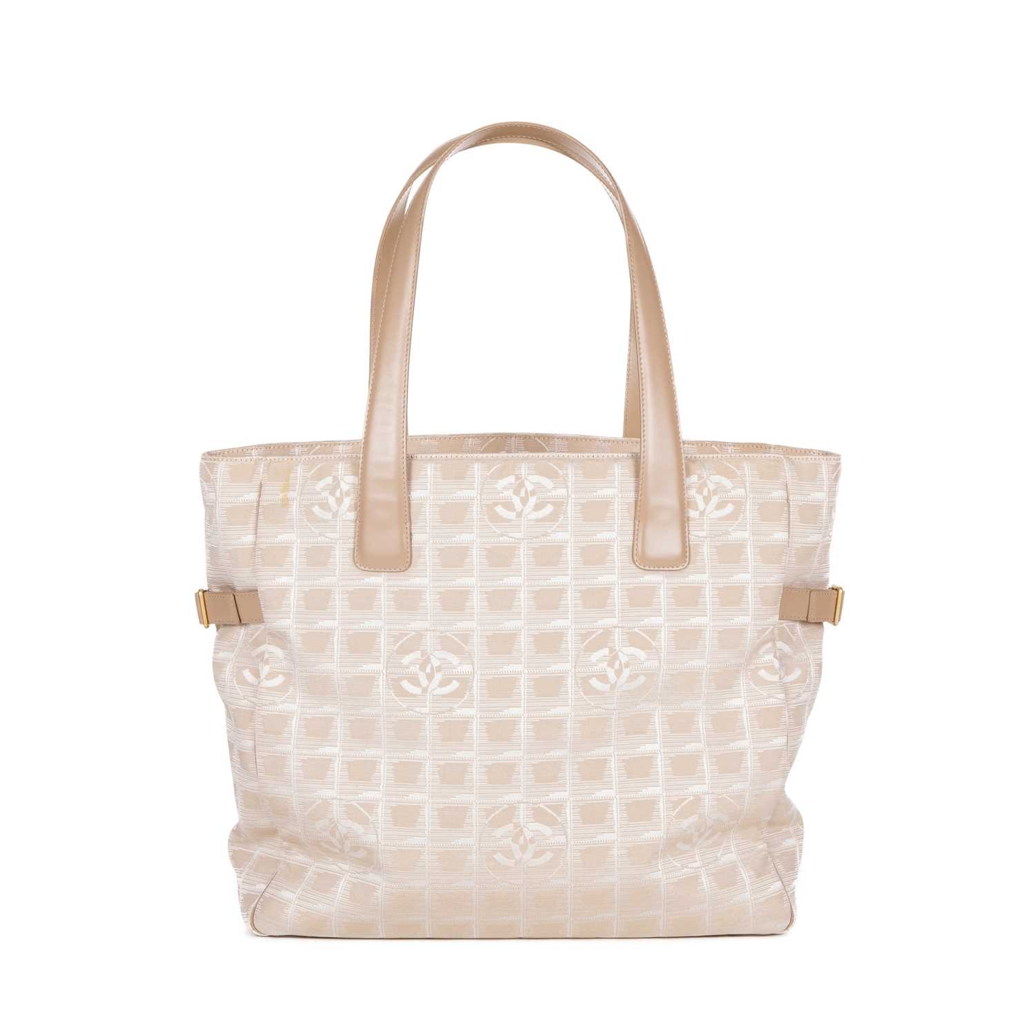 Chanel, a Travel Line tote, designed with a pale pink logo patterned canvas exterior, with beige - Image 2 of 4