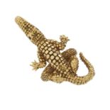A gold alligator dress ring