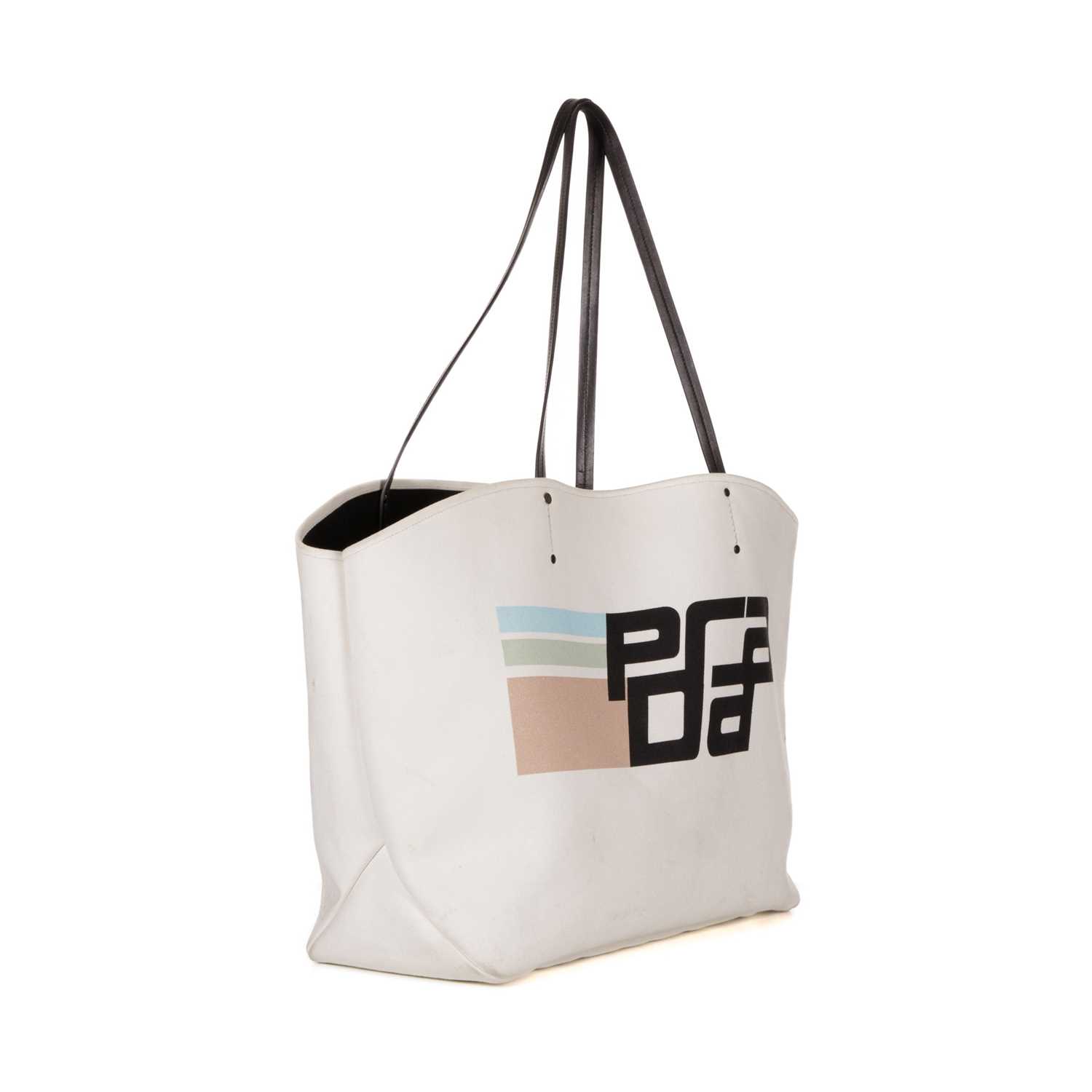 Prada, a large tote bag, designed with a cream canvas exterior, featuring the maker's graphic logo - Image 3 of 4