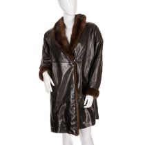 A fur-trimmed black leather coat, featuring ranch mink trim to include a lapel collar and cuffs,