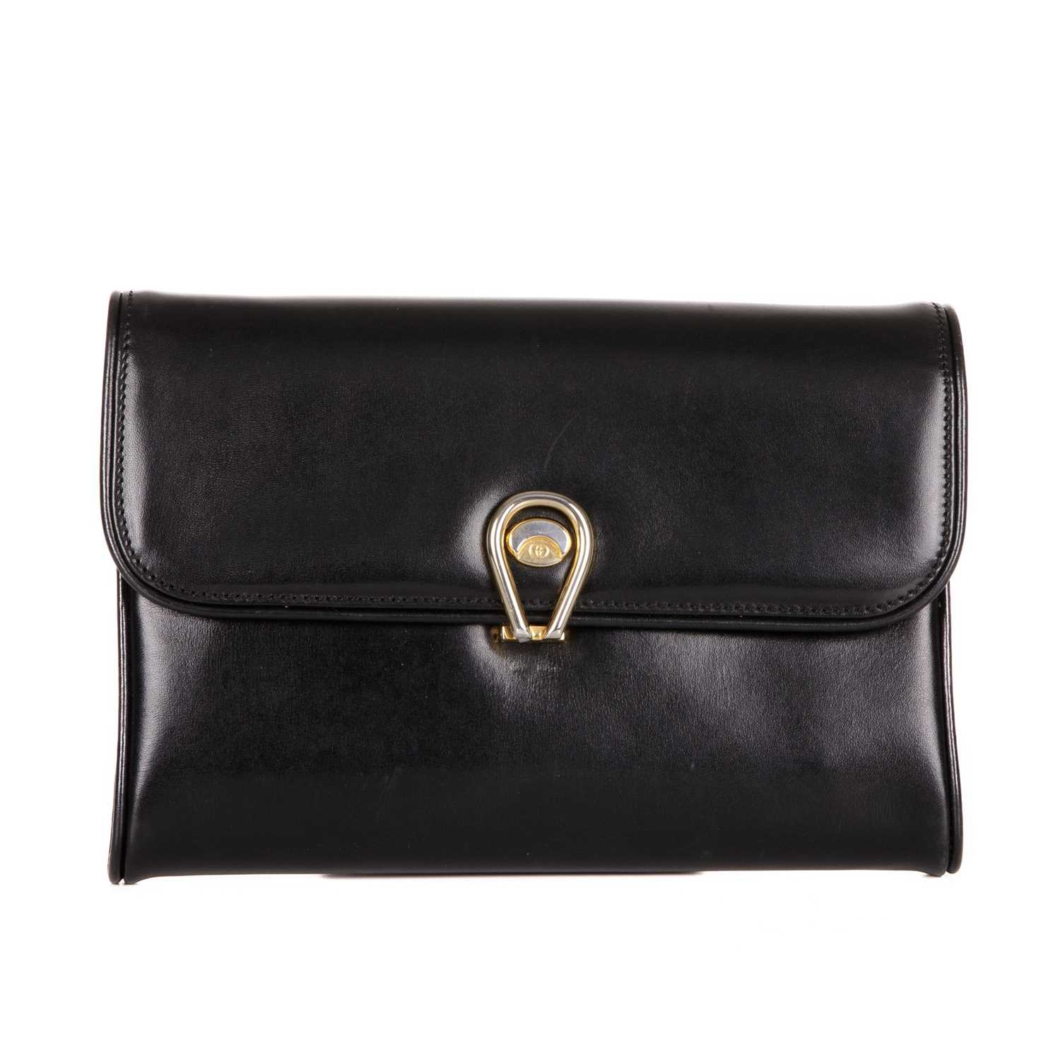 Gucci, a vintage black leather handbag, crafted from smooth black leather, featuring an adjustable