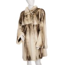 A two-tone natural white and graduated graphite sheared mink coat, featuring a short collar with