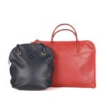 Longchamp, two leather bags, to include a navy blue leather shoulder bag, featuring tall leather