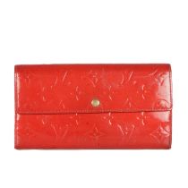 Louis Vuitton, a red monogram vernis Sarah wallet, designed with a red monogram embossed patent