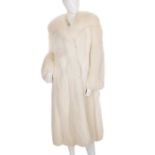 A full-length arctic fox fur coat, featuring a wide notched lapel collar, button loop fastenings,