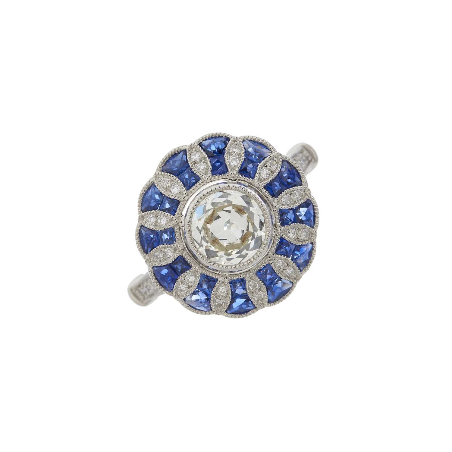 A platinum diamond and sapphire dress ring