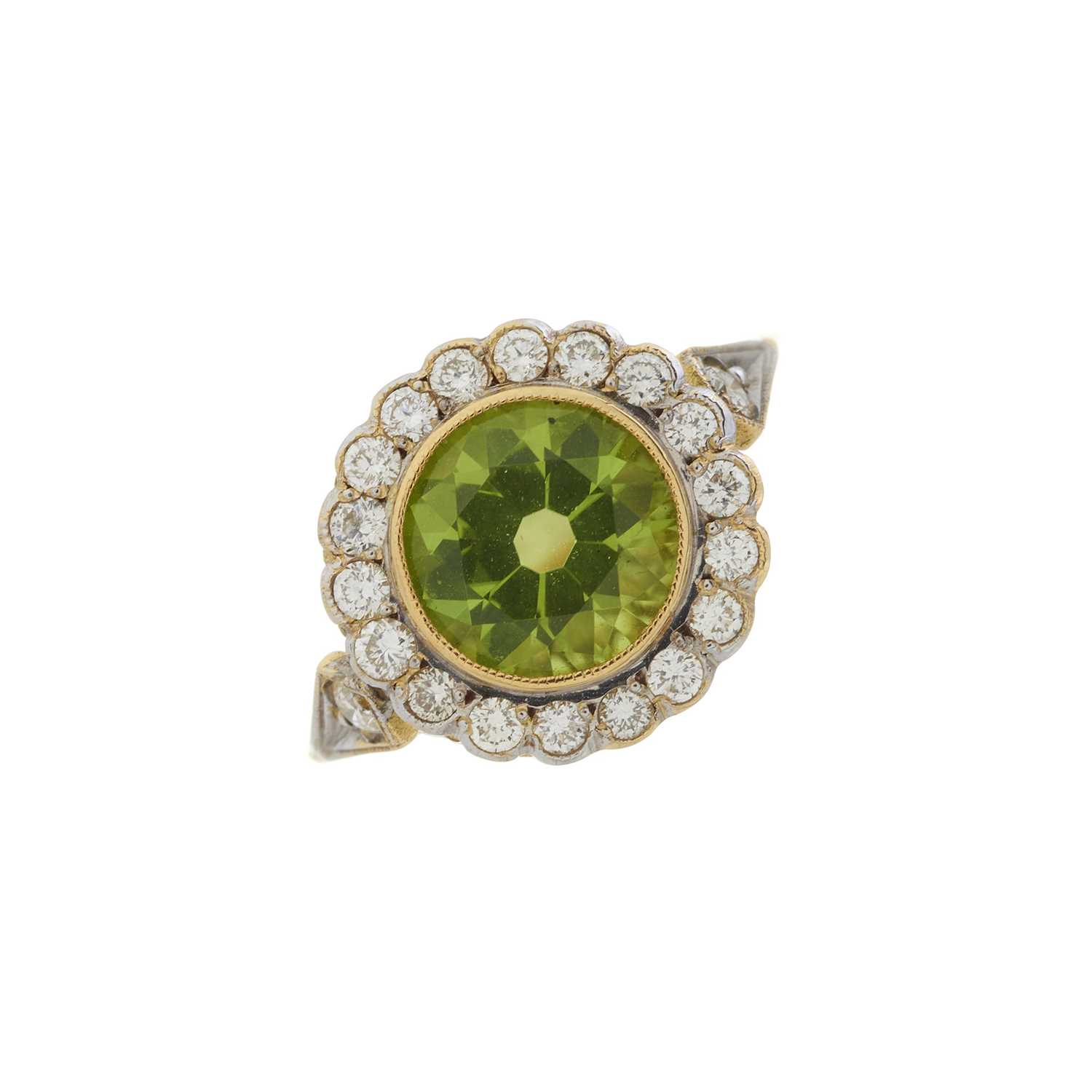 An 18ct gold peridot and diamond cluster ring