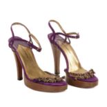 Dolce & Gabbana, a pair of heeled platform sandals, designed with purple suede uppers, featuring