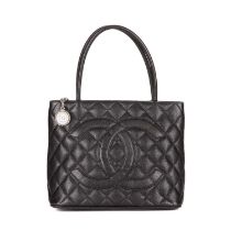 Chanel, a Timeless Medallion tote, crafted from black caviar leather with the maker's classic