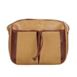 Cartier, a leather Must De Cartier crossbody bag, designed with a grained mustard yellow exterior,