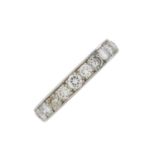 A mid 20th century platinum diamond full eternity ring