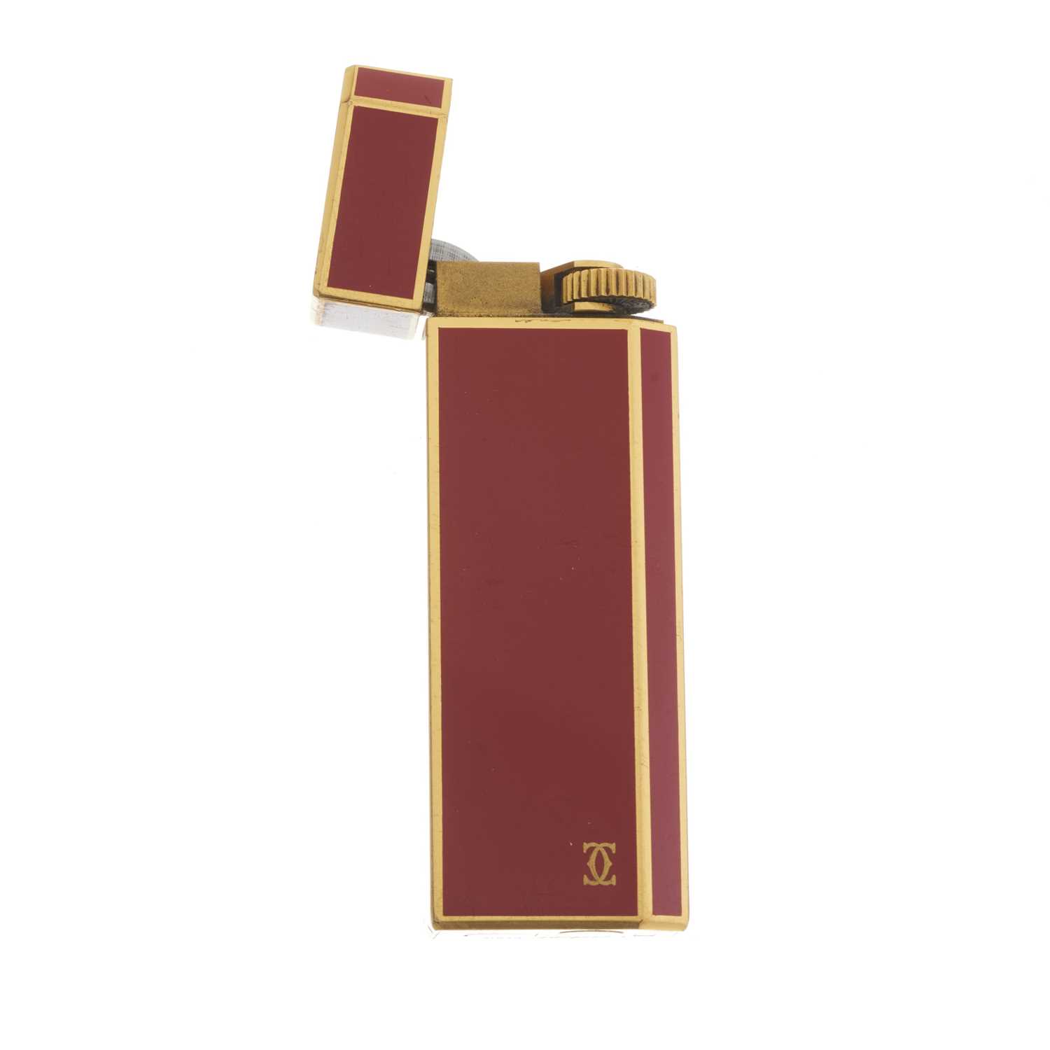 Cartier, an enamel lighter, designed with a gold-plated metal and burnt orange enamel casing, weight - Image 2 of 3