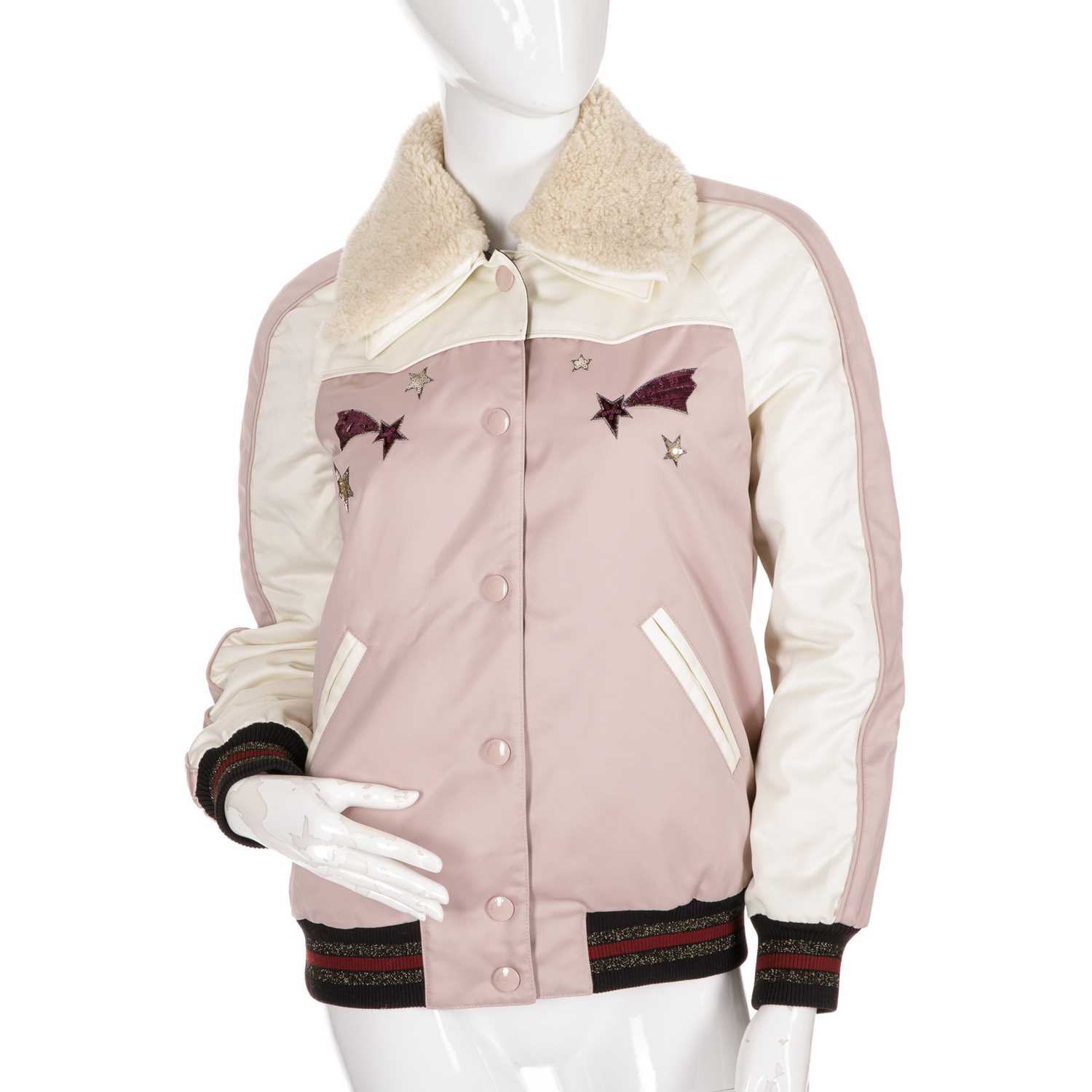 Coach, a ladies' bomber jacket, featuring a pink and cream polyester shell, with sequin star