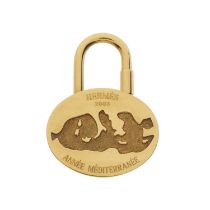 Hermes, a 2003 Mediterranean Cadena padlock charm, crafted from gold-tone metal, with front