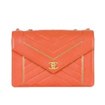 Chanel, a Reversed Chevron Envelope Flap handbag, crafted from peach lambskin leather, with