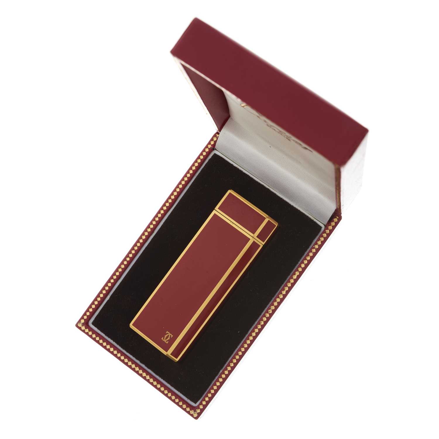 Cartier, an enamel lighter, designed with a gold-plated metal and burnt orange enamel casing, weight - Image 3 of 3