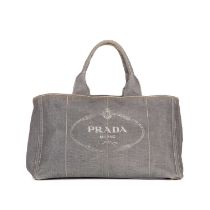 Prada, a Canapa Logo tote, crafted from distressed grey canvas, featuring the maker's logo to the