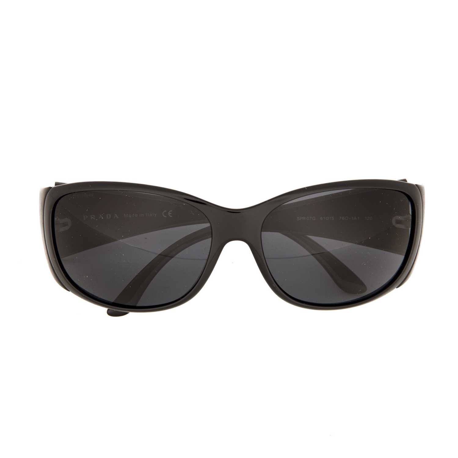 Prada, a pair of sunglasses, designed with blue tinted lenses and black acetate frames, with maker's