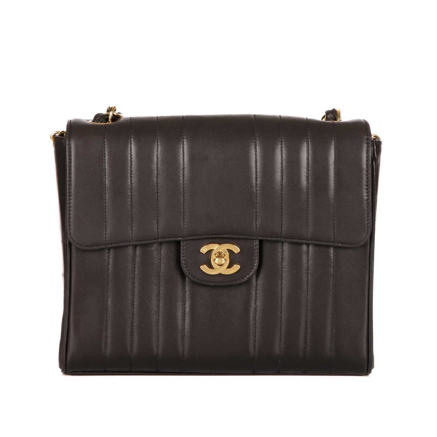 Chanel, a vintage vertical Classic Flap handbag, crafted from black lambskin leather, with