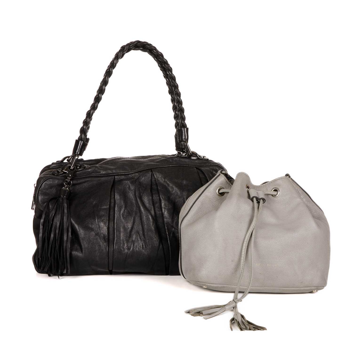 Coccinelle, two leather handbags, to include a black leather handbag, featuring a detachable leather