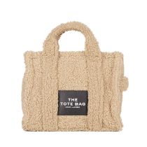 Marc Jacobs, a Medium Teddy Tote, crafted from beige teddy fabric with black leather trim, featuring