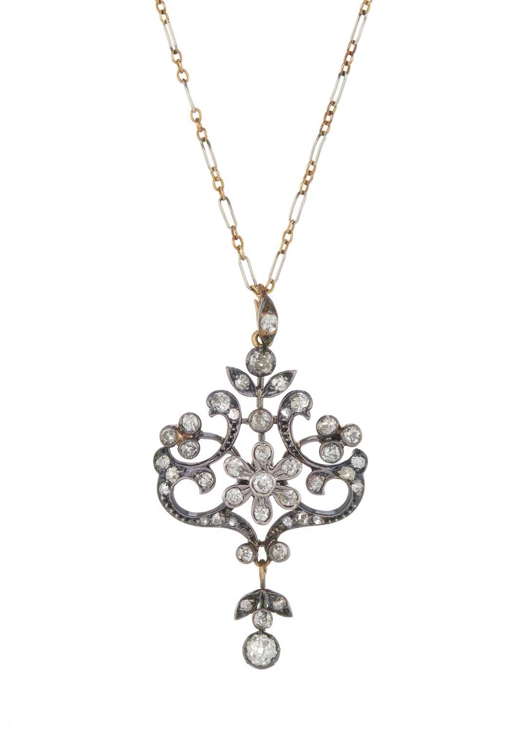 A Belle Epoque silver and gold diamond pendant, with chain