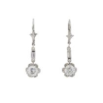 A pair of brilliant-cut diamond drop earrings