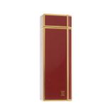 Cartier, an enamel lighter, designed with a gold-plated metal and burnt orange enamel casing, weight
