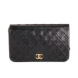 Chanel, a vintage CC Push Lock Full Flap handbag, designed with a diamond quilted black leather