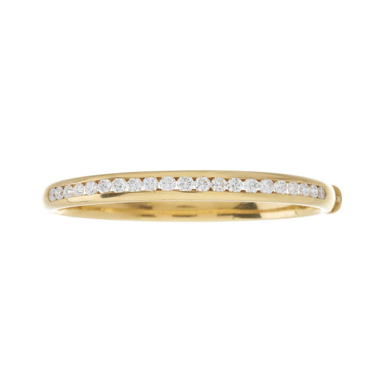 An 18ct gold diamond line bangle bracelet