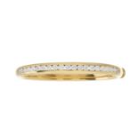 An 18ct gold diamond line bangle bracelet