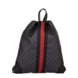 Gucci, a Supreme Web drawstring backpack, crafted from the maker's black GG coated canvas with