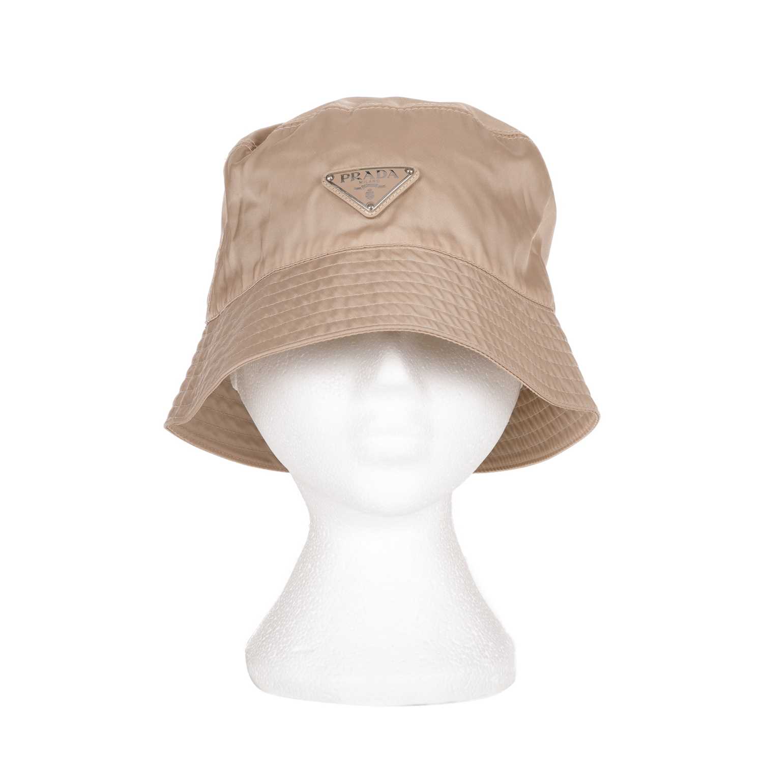 Prada, a Tesutto bucket hat, crafted from beige nylon, featuring the maker's triangular enamelled - Image 2 of 3