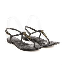 Chanel, a pair of star thong sandals, crafted from black leather, featuring CC star embellishments