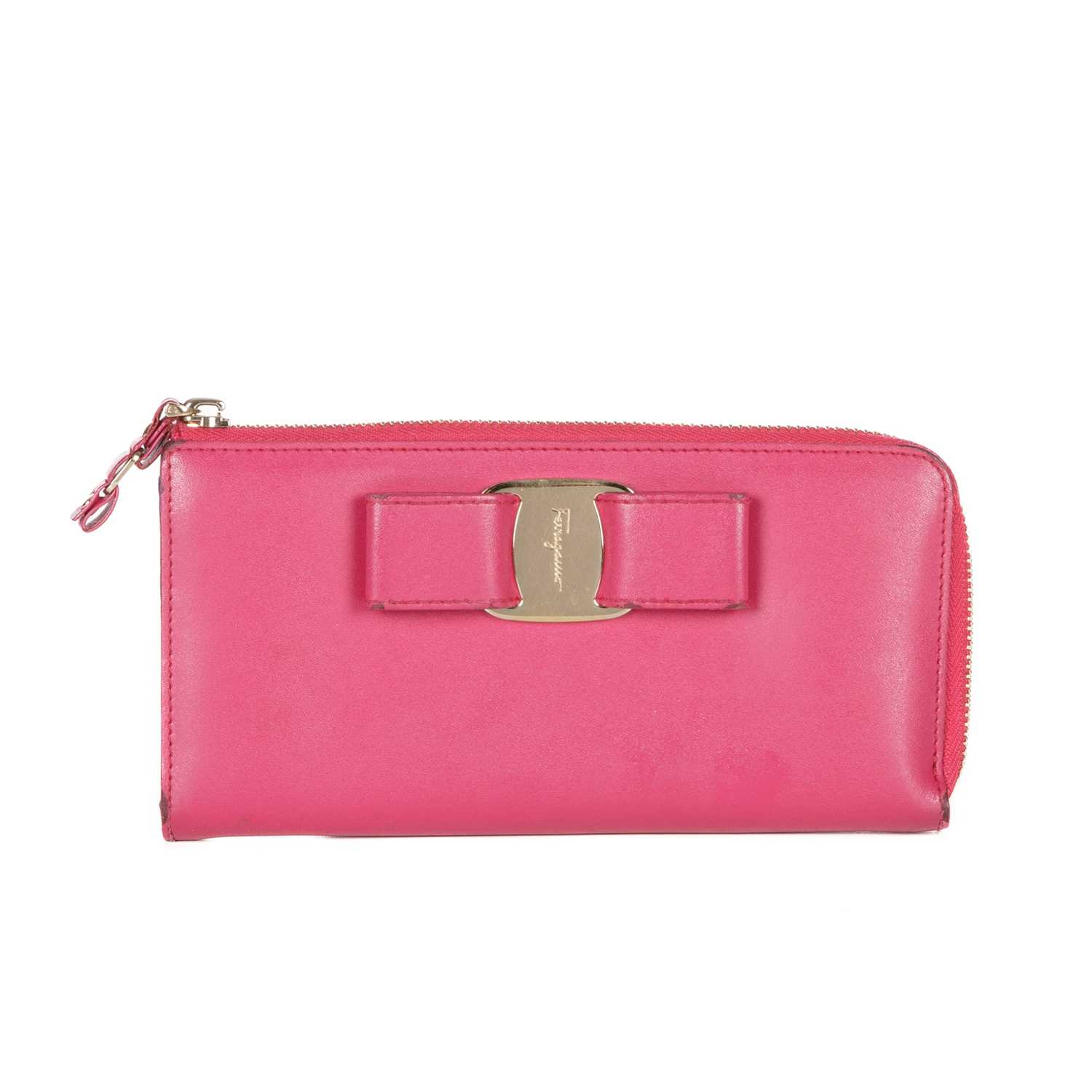 Salvatore Ferragamo, a Vara Bow long wallet, crafted from smooth fuchsia pink leather, featuring