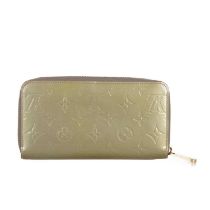 Louis Vuitton, a monogram vernis zippy wallet, designed with a gold monogram embossed patent leather