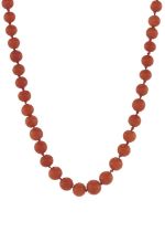 An early 20th century coral single-strand necklace, with gold clasp