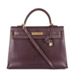 Hermes, a 2001 Kelly Sellier 35 handbag, crafted from Chevre Coromandel plum leather, with gold