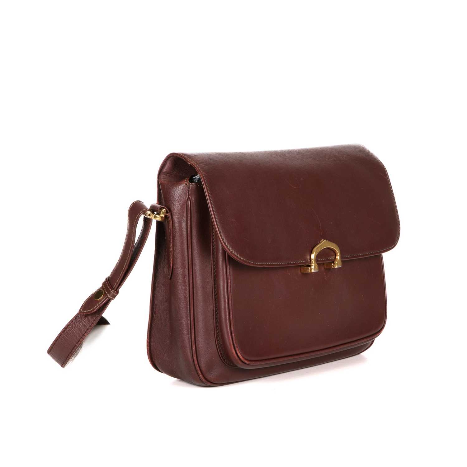 Cartier, a Bordeaux leather handbag, designed with a burgundy leather exterior, featuring gold- - Image 3 of 4