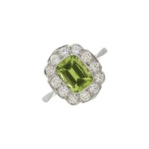 A platinum peridot and diamond cluster ring