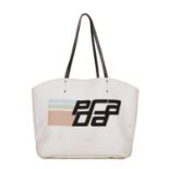 Prada, a large tote bag, designed with a cream canvas exterior, featuring the maker's graphic logo