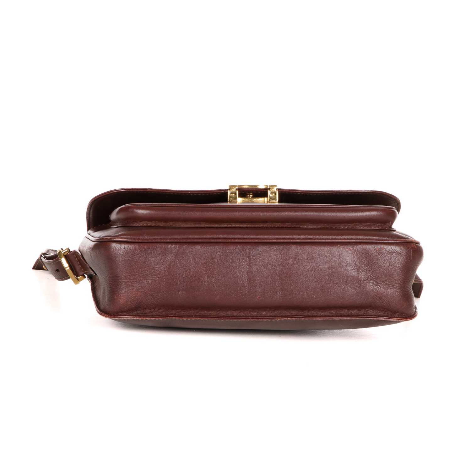 Cartier, a Bordeaux leather handbag, designed with a burgundy leather exterior, featuring gold- - Image 4 of 4