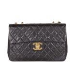 Chanel, a vintage Maxi Single Flap handbag, designed with a diamond quilted black leather