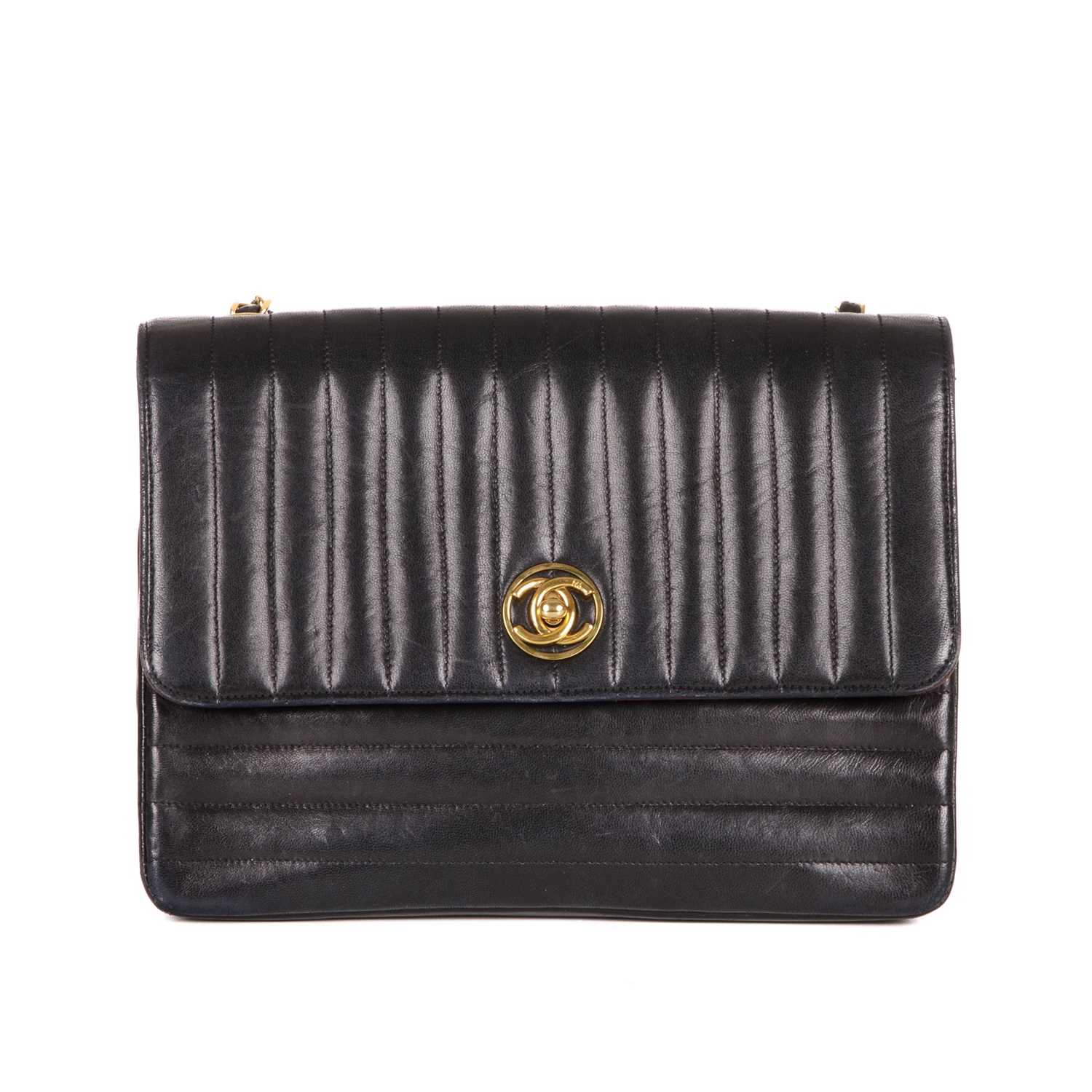 Chanel, a vintage quilted Single Flap handbag, featuring a vertical quilted black lambskin leather