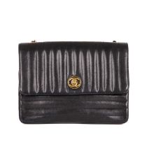 Chanel, a vintage quilted Single Flap handbag, featuring a vertical quilted black lambskin leather