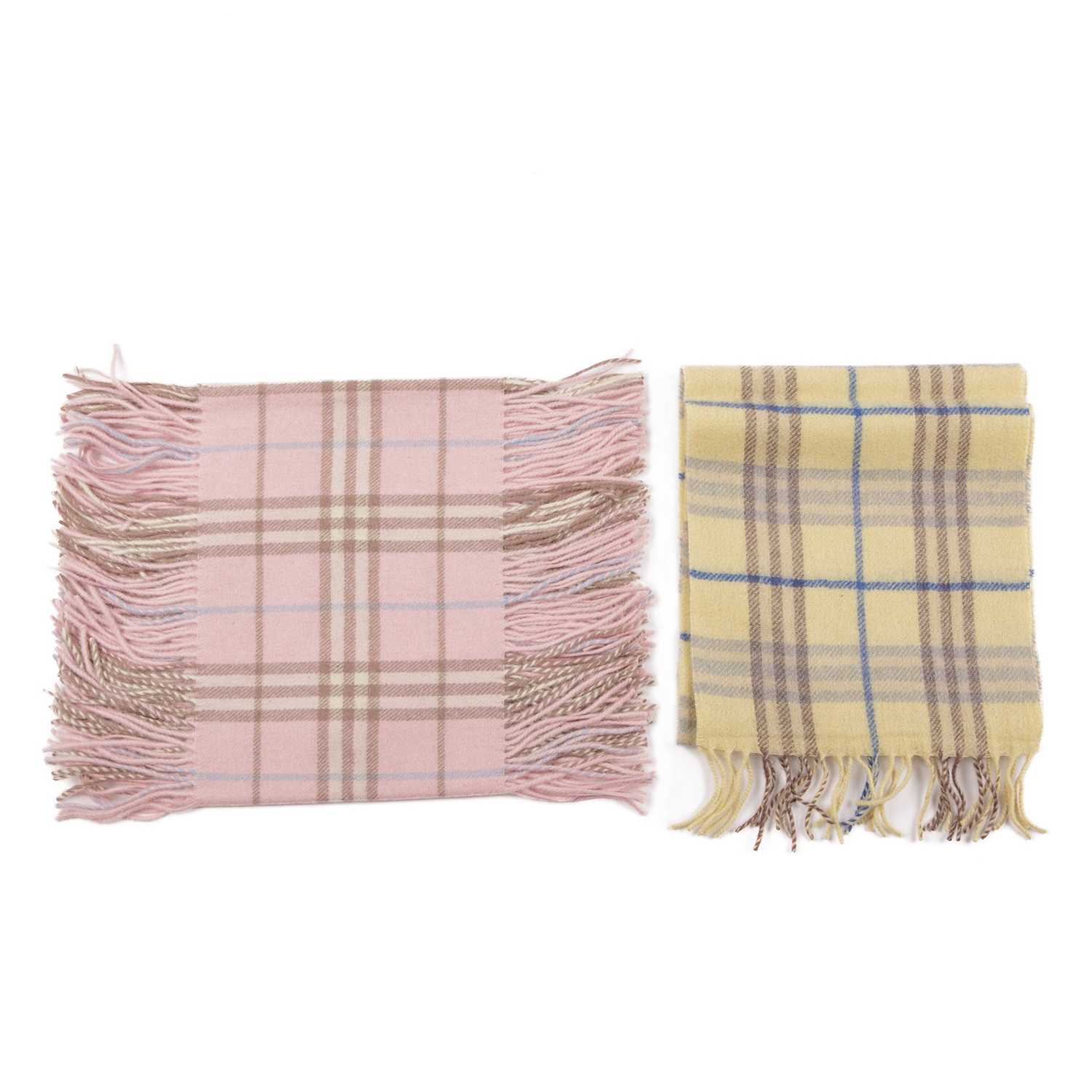 Burberry, two Nova Check lambswool scarves, to include a pale yellow scarf with fringe detailing