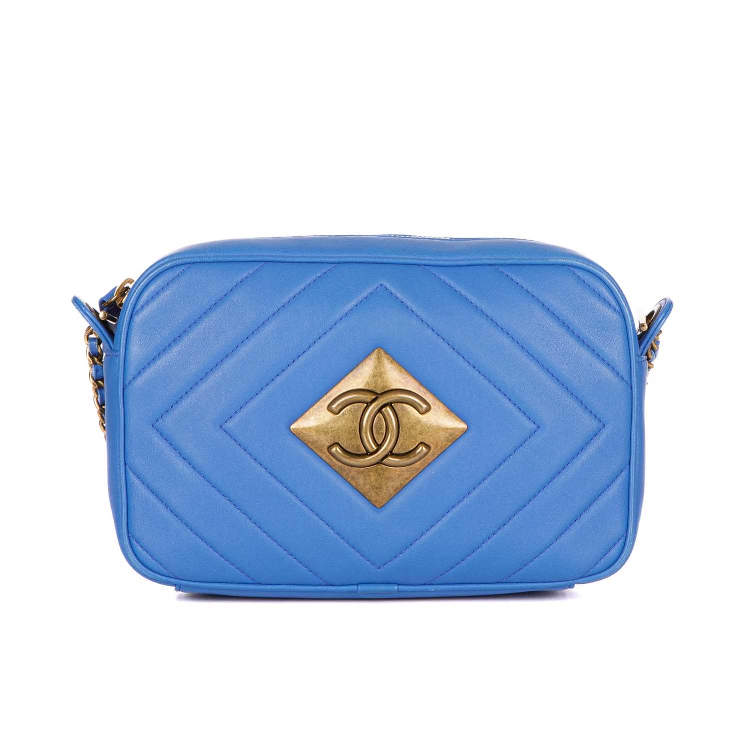 Chanel, a Pyramid camera bag, featuring a blue diamond-quilted leather exterior, with aged gold-tone