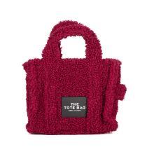 Marc Jacobs, a Small Teddy Tote, crafted from burgundy teddy fabric with black leather trim,