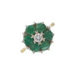 An 18ct gold emerald and diamond cluster ring