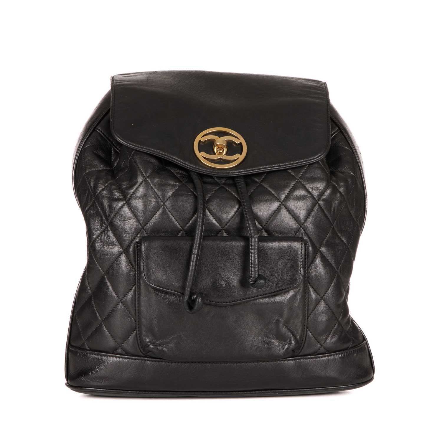 Chanel, a vintage black quilted leather backpack w/pouch, featuring gold-tone hardware, a front